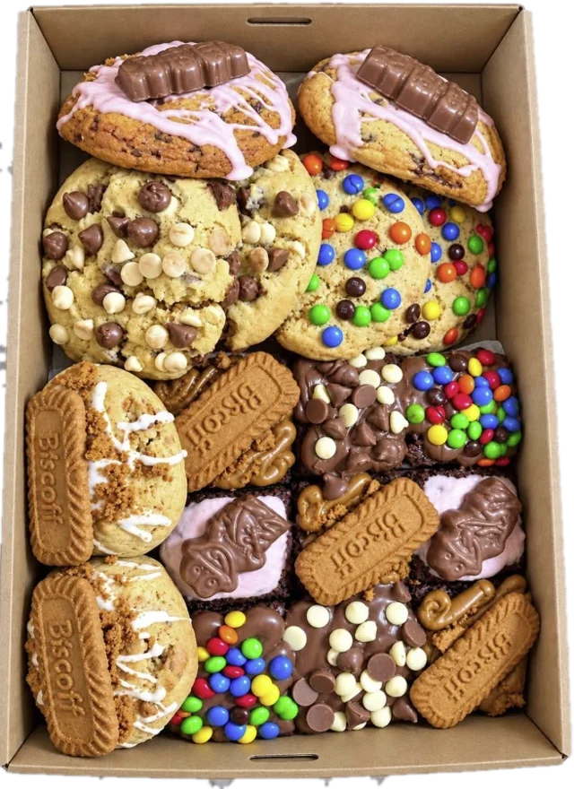 A mixed box of loaded cookies and brownies in a kraft box